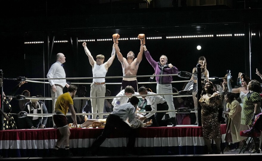 Ryan Speedo Green (center), Paul Groves (purple jacket) and Latonia Moore (right) in Terence Blanchard’s CHAMPION at the Metropolitan Opera.