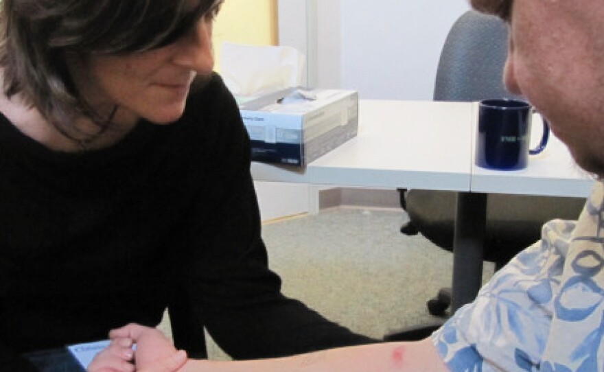 Dr. Christina Milano checks Jeremie Seals during a routine appointment.