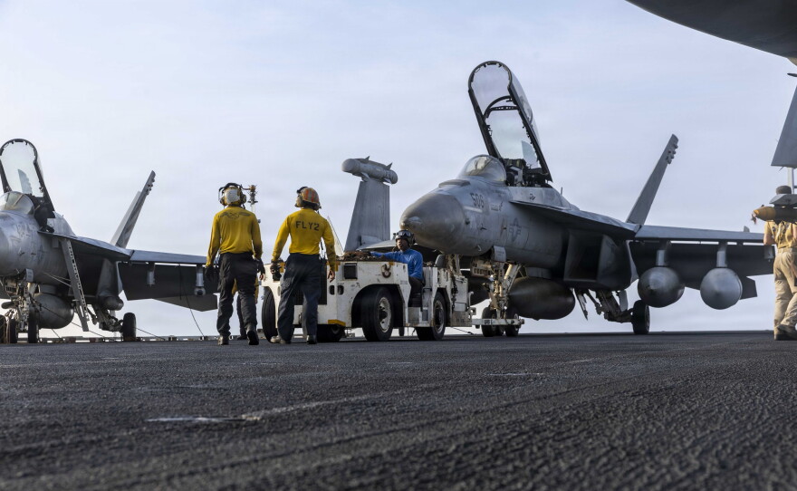 U.S. Sailors tow an EA-18G Growler, assigned to Electronic Attack Squadron (VAQ) 133, on the flight deck of Nimitz-class aircraft carrier USS Abraham Lincoln (CVN 72), July 30, 2026.