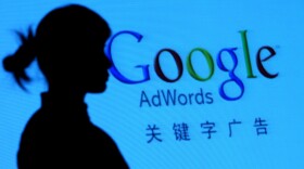 XIAN, CHINA - NOVEMBER 20: (CHINA OUT) An etiquette girl is reflected on a big screen at the Google's 2008 Xian winter marketing forum on November 20, 2008 in Xian of Shaanxi Province, China.