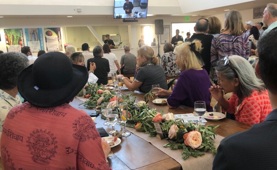 Watching a cooking demonstration at the opening of the Green Oceanside Kitchen. June 23rd, 2019.
