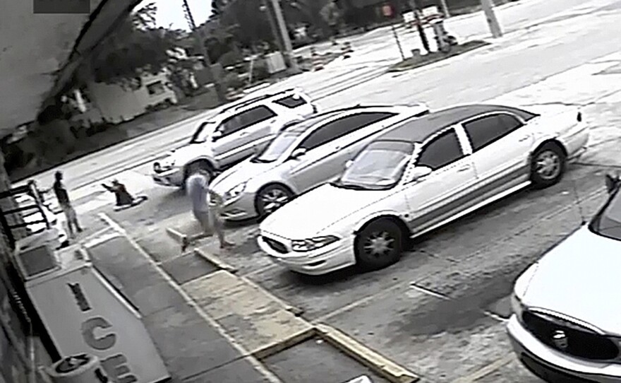 In surveillance video, Markeis McGlockton (far left) is shot by Michael Drejka during an altercation in a convenience store parking lot in Clearwater, Fla., in July 2018.