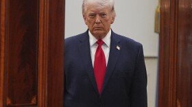 President Donald Trump arrives from the Blue Room to speak about the Iran war from the Cross Hall of the White House on April 1.