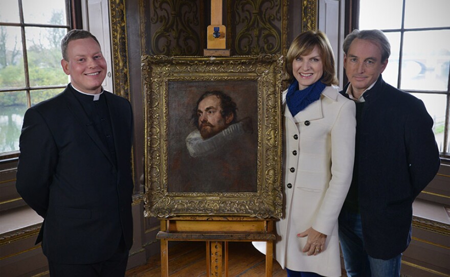 Fiona Bruce (center), Philip Mould (right) and Father Jamie McCleod (left) with the genuine Van Dyck.