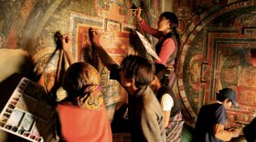 This program, narrated by Richard Gere, presents the remarkable story of a Tibetan culture pulled back from the brink of extinction through the restoration of its most sacred sites. Pictured: Workers restore a mandala.