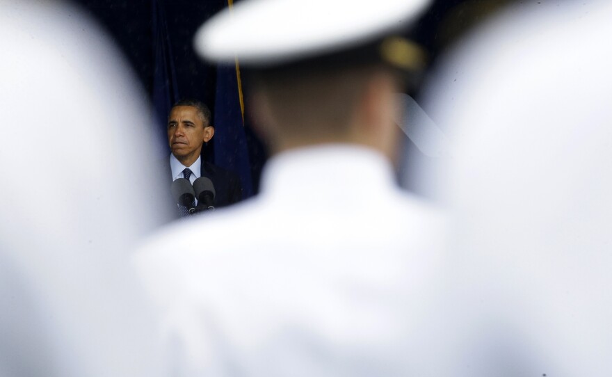 President Obama speaks at the commencement ceremony for the United States Naval Academy in Annapolis, Md., on Friday. The president urged new graduates to exhibit honor and courage in tackling incidents of sexual assault as they assume leadership positions in the military.