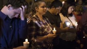 Mourners participate in a candlelight vigil held for the victims of a fatal shooting at the First Baptist Church of Sutherland Springs, Sunday, Nov. 5, 2017, in Sutherland Springs, Texas.