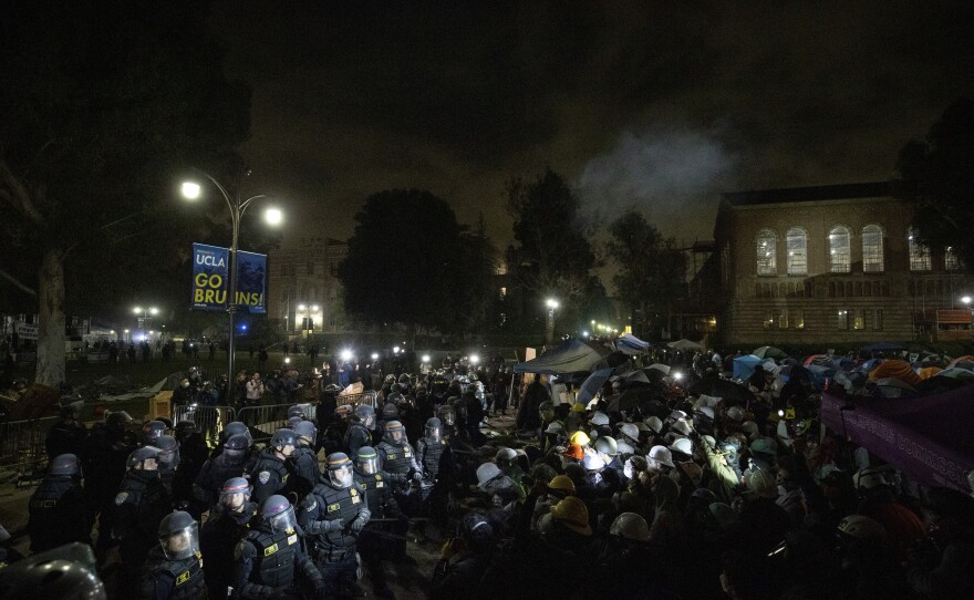 Police advance on pro-Palestinian demonstrators on the UCLA campus Thursday, May 2, 2024, in Los Angeles.
