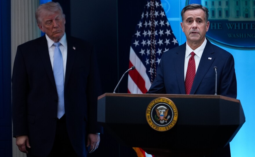 FILE - CIA Director John Ratcliffe, accompanied by President Donald Trump, speaks with reporters in the James Brady Press Briefing Room at the White House in Washington, April 6, 2026.