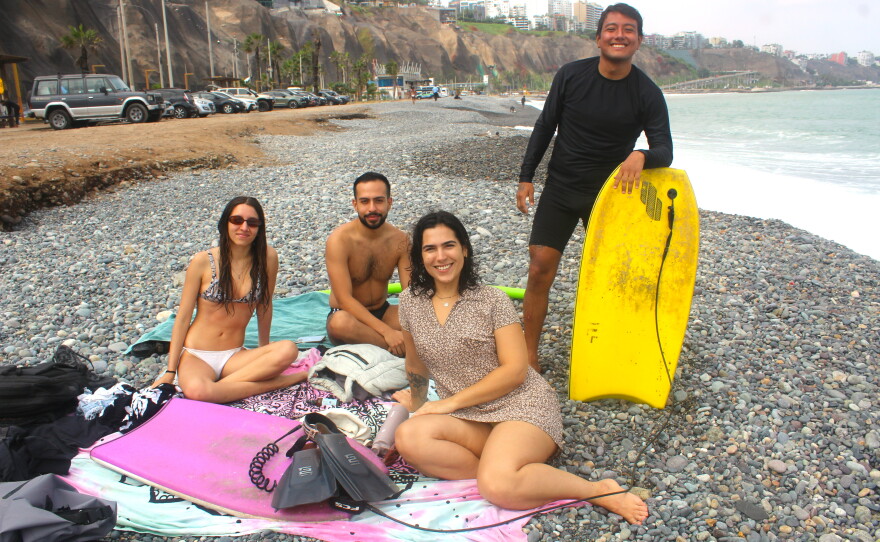 Fabricia Laura (bottom right) with friends, after bodyboarding in the Pacific Ocean.