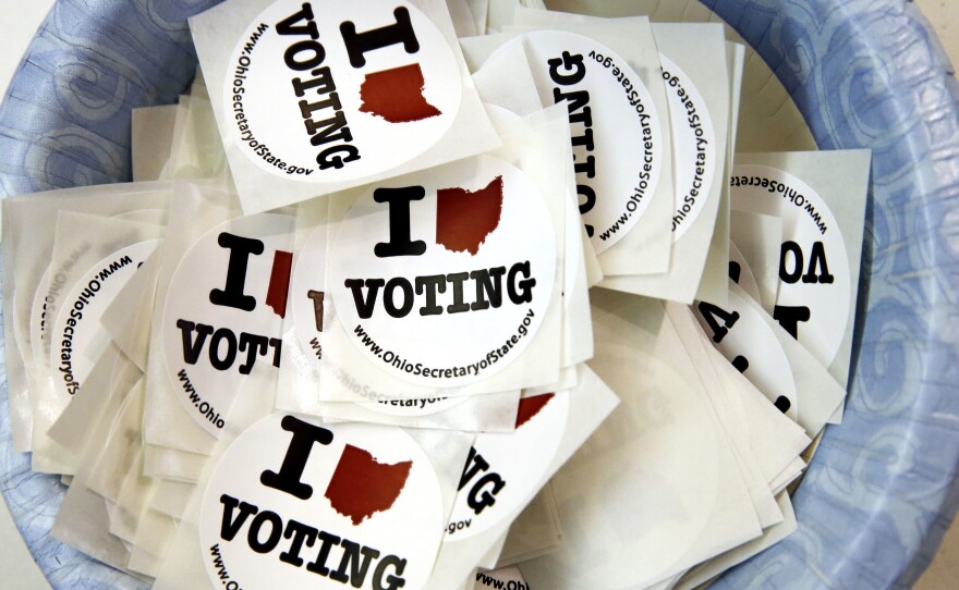 Stickers were on hand at a polling place during the primary election earlier this year in Westerville, Ohio. Friday, a judge in Ohio warned the campaigns not to intimidate voters.