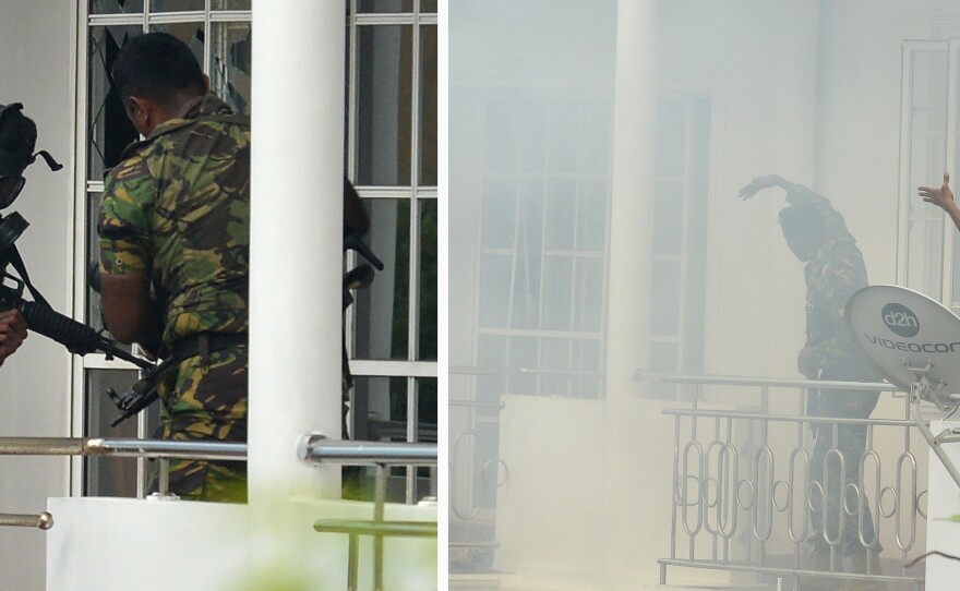 Sri Lankan Special Task Force personnel raid a house — after a blast killed police searching the property — in the Orugodawatta area of Colombo.
