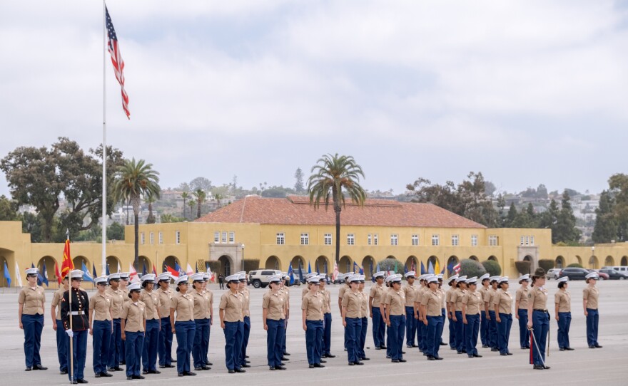 The women of Platoon 3241 standing at attention during the graduation ceremony at Marine Corps Recruit Depot, San Diego, May 6, 2021.