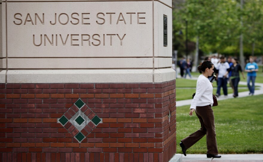 File photo of people walking on the campus of San Jose State University in San Jose, Calif., on May 5, 2009. 