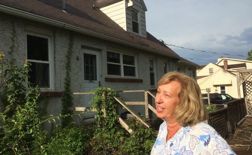 The house next door to Maureen and Michael McCabe has been sitting empty for seven years. "It freaks me out," Maureen McCabe says. "I don't know if there's animals running around there, mice and rodents."