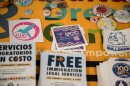Stickers and flyers on a table in the Undocumented Community Center at the College of San Mateo in San Mateo, on Nov. 28, 2023. At this center, students without legal status can access financial and legal aid as well as guidance in navigating grant applications.