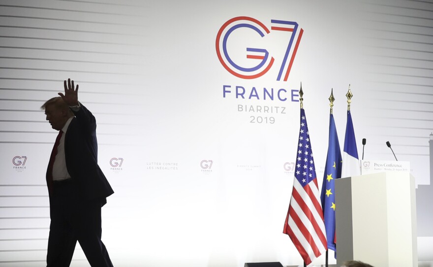 President Donald Trump walks off after taking additional questions following and a joint press conference with French President Emmanuel Macron at the G-7 summit in 2019.