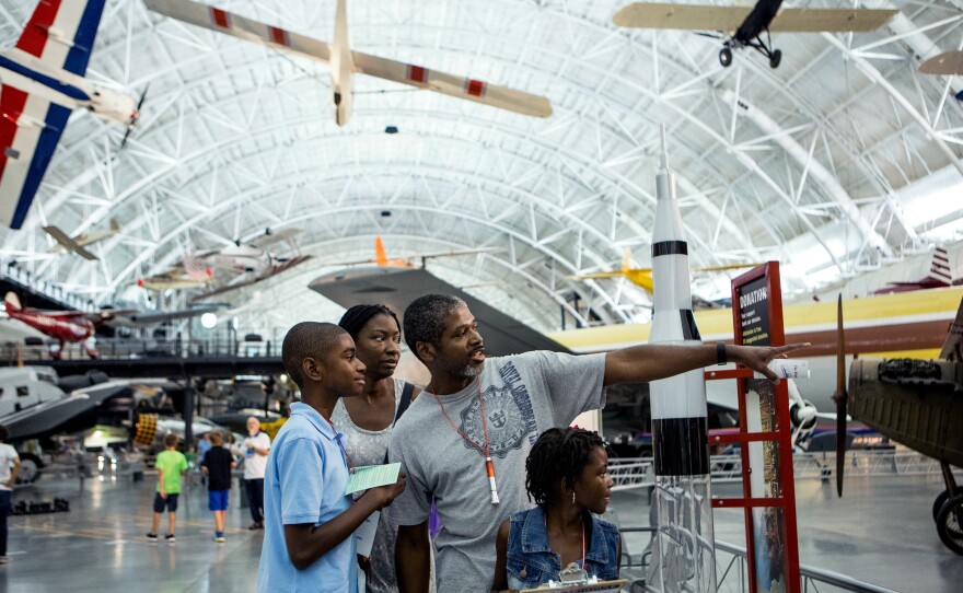 The Brown family (left to right) â Malachi, 12; Lisa Nelson-Brown; Will; and Maiyah, 7 â ÂÂgo on a scavenger hunt at the museum sleepover.