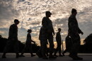 Members of the National Guard walk past the Lincoln Memorial Reflecting Pool before the March on Washington, Friday, Aug. 28, 2026, in Washington.