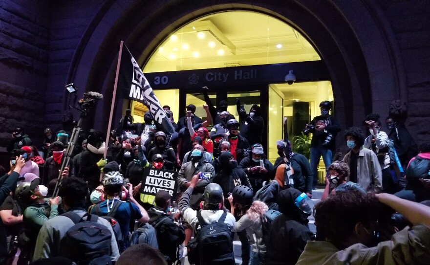 Marchers gather outside Rochester City Hall earlier this month. Some Black protest leaders worry white allies will march and carry signs but then go back to their lives, even if nothing changes to make Black people safer.