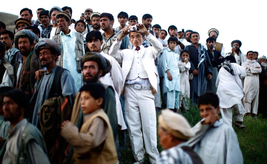 Afghan president Hamid Karzai holds a rally in a remote village<em> </em>in 2009.