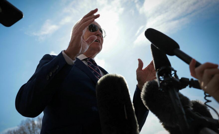 President Biden talks to the press on the South Lawn of the White House before boarding Marine One on March 28 for a trip to Durham, N.C.