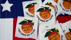 In this file photo, stickers sit on a table inside a polling place on Nov. 5, 2024, in Atlanta.