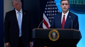 FILE - CIA Director John Ratcliffe, accompanied by President Donald Trump, speaks with reporters in the James Brady Press Briefing Room at the White House in Washington, April 6, 2026.