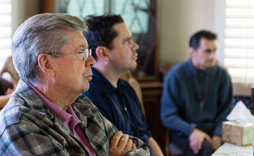 Relatives gathered around a dining room table as neurologist John Ringman gave a presentation about Alzheimer's disease and current research in Riverside, Calif., in 2015.