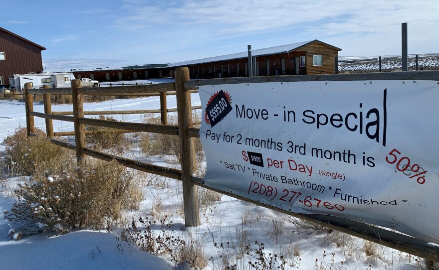 A sign in the Jonah Field advertises cheap rates at a deserted motel built for oil and gas workers.