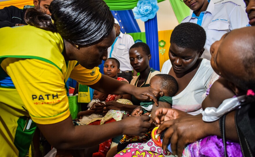 A health worker vaccinates a Kenyan child with the world's first malaria vaccine. Kenya has given at least one dose to 300,000 children so far.