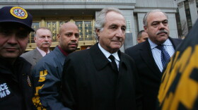 Bernard Madoff is taken into custody by law enforcement officials, 2008
