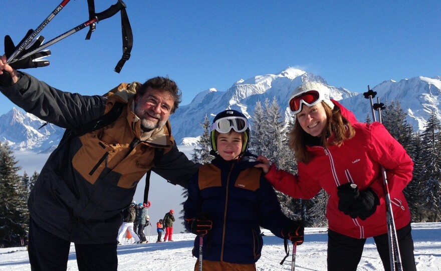 NPR Paris correspondent Eleanor Beardsley (right) with her husband Ulysse Gosset and son Maxime on a ski vacation in the Alps in February. When she first moved to France, Beardsley enjoyed the frequent holidays. But combined with many school breaks, she and other working parents often find it becomes a burden.