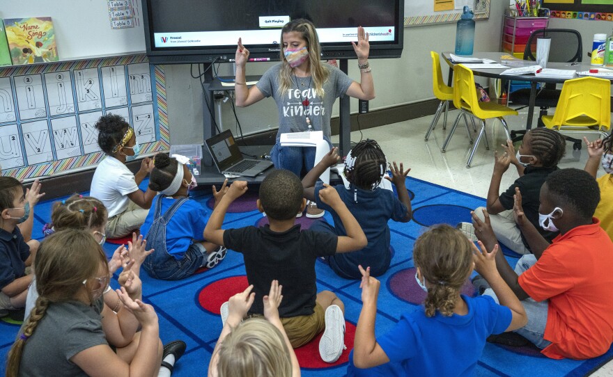 Nashville kindergarten teacher Amber Updegrove leads her class in a lesson earlier this month. On Monday, the U.S. Education Department announced an investigation into Tennessee's requirement that schools allow families to opt out of mask mandates.