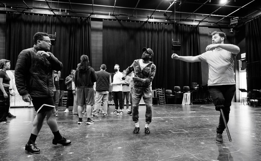 Daniel J. Watts (center) working on choreography with cast members during a rehearsal for "3 Summers of Lincoln."