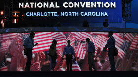 People are seen on stage as preparations are made at the Time Warner Cable Arena for the Democratic National Convention Committee on September 1, 2012 in Charlotte, North Carolina. 