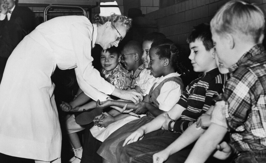 A nurse prepares children for a polio vaccine shot as part of a city-wide testing of the vaccine on elementary school students in Pittsburgh, 1954.