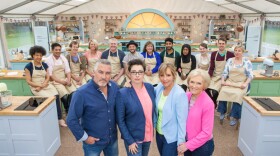 The judges, hosts, and contestants of THE GREAT BRITISH BAKING SHOW, Season 3. Contestants (back, l-r): Dorret, Alvin, Ian, Ugne, Paul, Stu, Marie, Tamal, Nadiya, Flora, Mat, Sandy. Judges/Hosts (front, l-r): Paul Hollywood, Sue Perkins, Mel Giedroyc, Mary Berry.