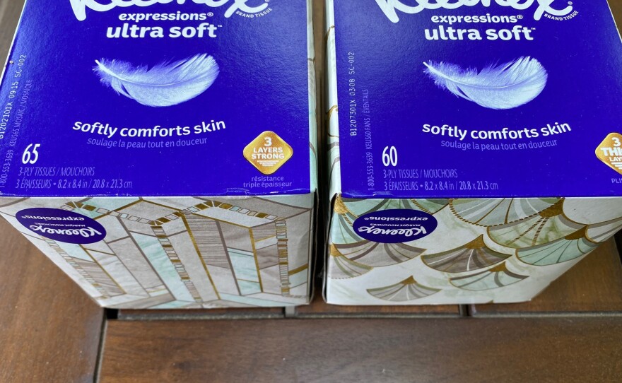 Two boxes of Kleenex tissues are displayed in Ann Arbor, Mich., on May 25. In the U.S., a small box of Kleenex now has 60 tissues; a few months ago, it had 65.