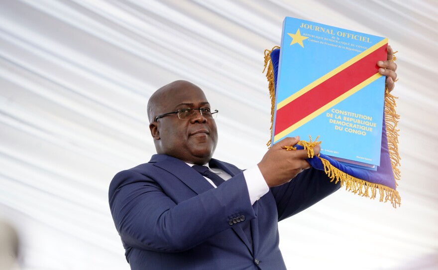 Felix Tshisekedi holds the constitution after being sworn in Thursday as president of the Democratic Republic of the Congo.