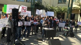 Crowds of people gathered outside the Escondido City Council chambers as the council weighs voting to support the Trump administration's lawsuit against California's sanctuary state laws, April 4, 2018. 