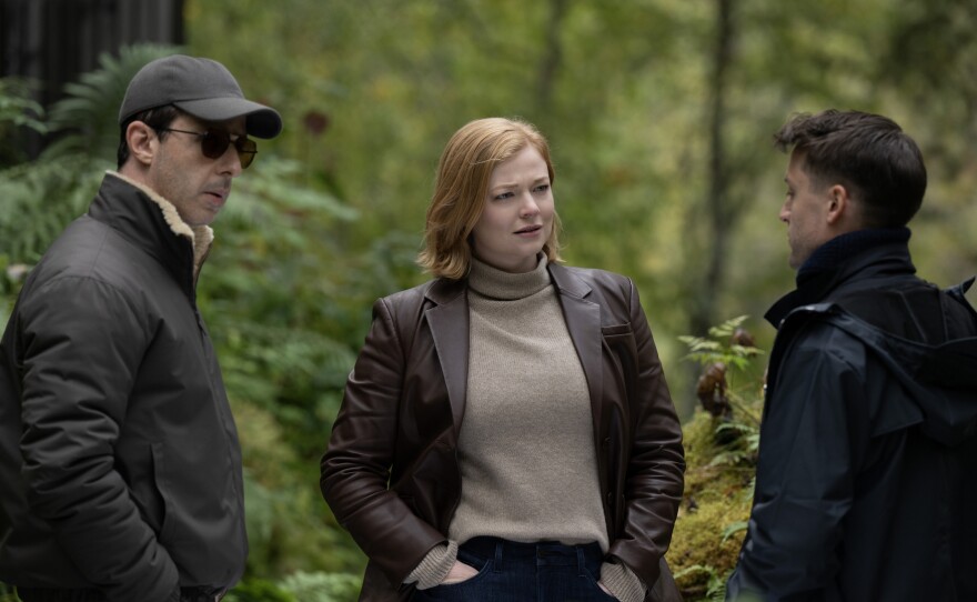 Kendall (Jeremy Strong), Shiv (Sarah Snook) and Roman (Kieran Culkin). You can really notice in this scene how putting them outside walking in the lush woods makes this conversation seem warmer.