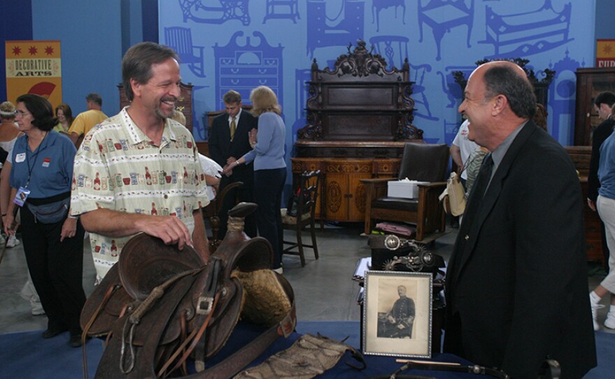 Bruce M. Shackelford (right) appraises a California riding outfit, ca. 1895, in Reno, Nev. 