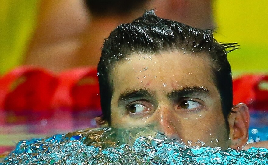 Michael Phelps reacts following the men's 200m butterfly final at the Gold Coast Aquatic Centre in Gold Coast in August.