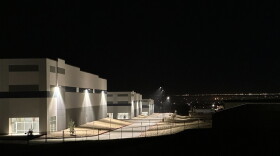 A massive 826,780-square-foot warehouse sits illuminated Feb. 12, 2026, in the El Paso suburb of Socorro, Texas, that was recently purchased by the U.S. Department of Homeland Security for $122.8 million.