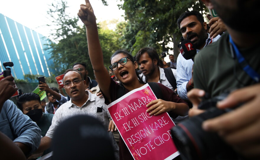 Student activist Neha Bora, center, shouts slogans during a youth demonstration demanding the resignation of the country's election chief Gyanesh Kumar, in New Delhi, India, Friday, Oct. 16, 2026.