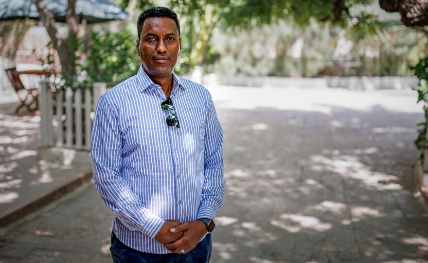 Burhan Warsame Abdi inside the courtyard of the heavily fortified Peace Hotel in the Somali capital. "Look around in Mogadishu and you will be surprised," he says of the recent progress in a place often written off as a failed state.