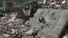 Mexican Army rescue workers search for people trapped in collapsed buildings after earthquakes struck La Guaira, Venezuela, Sunday, June 28, 2026.
