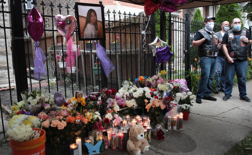 Candles burn in front of a memorial for Lena Nunez, 10, on June 29 in Chicago. The child was shot and killed by a stray bullet while watching TV with her brother in her grandmother's home, reports say.