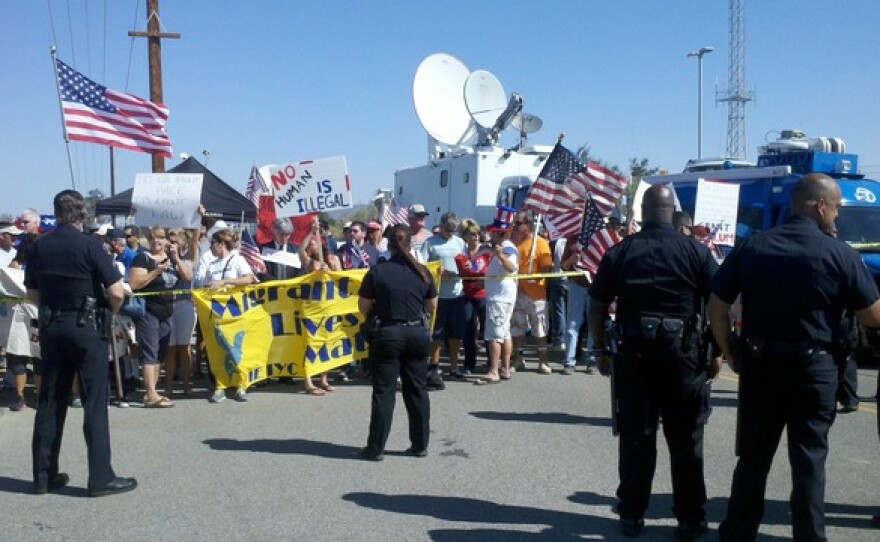 Pro- and anti-immigration protesters gathered outside a U.S. Border Patrol station in Murrieta,  July 4, 2014.